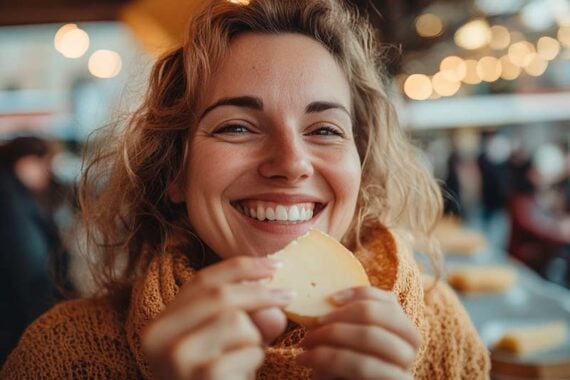 Photo of a female eating cheese