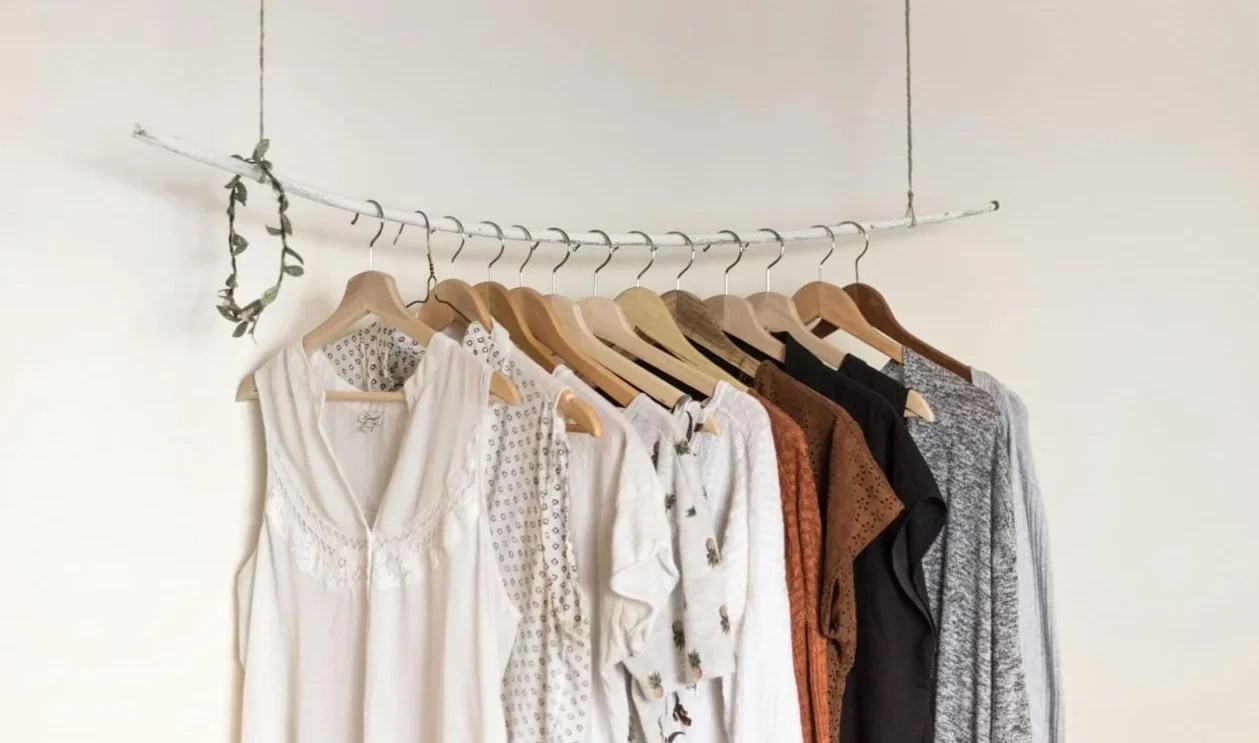 line of clothing hanging in a room