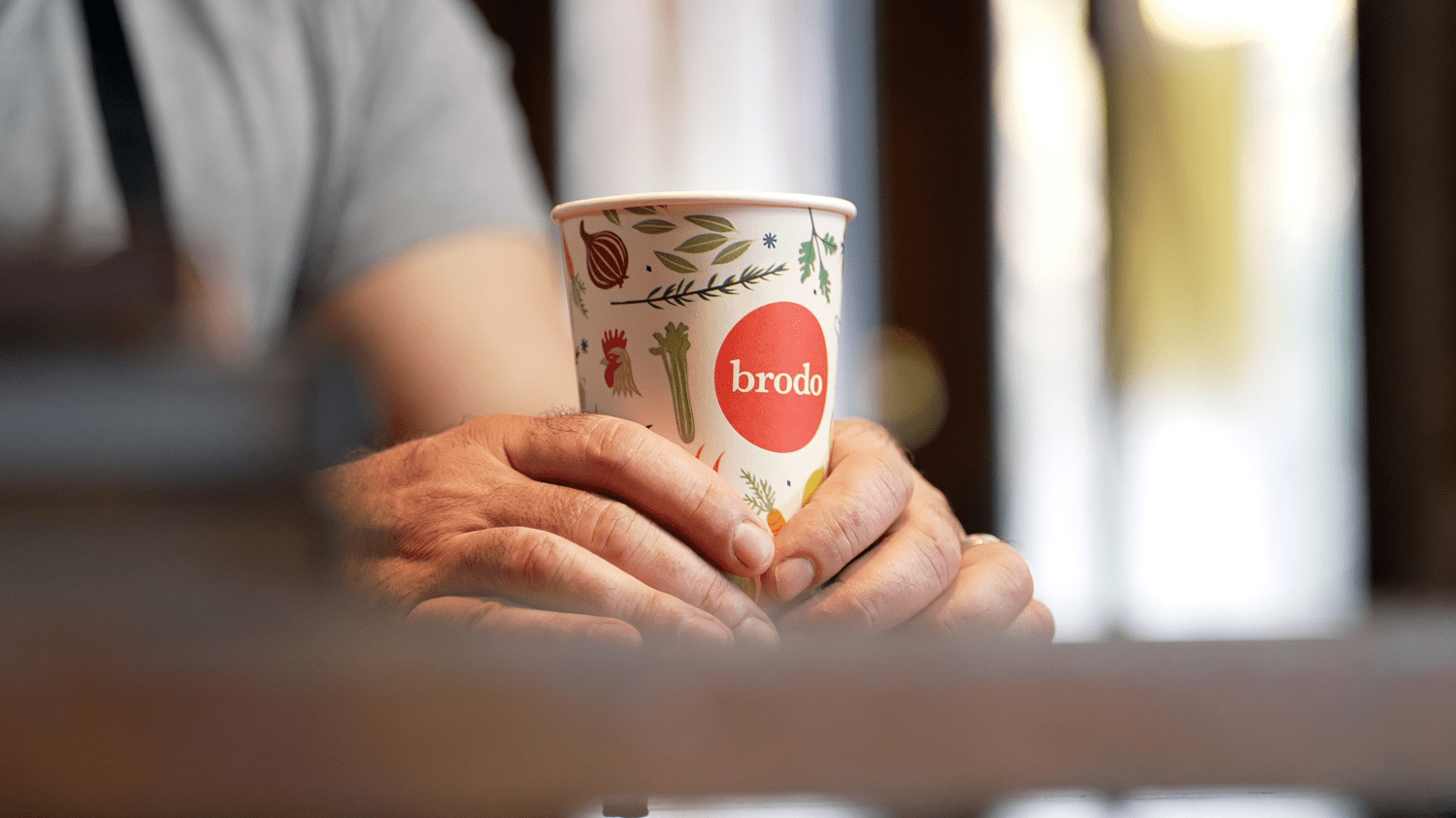 a photo of a branded Brodo broth cup
