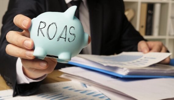 ROAS stamped on a piggy bank