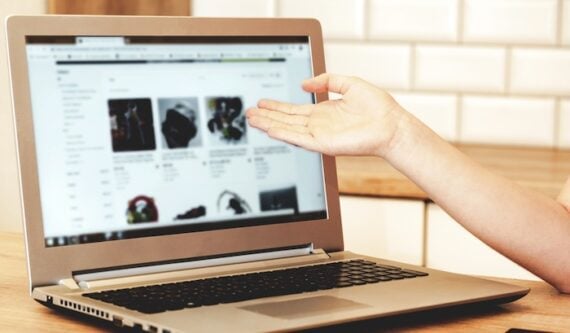 Photo of a laptop on a table showing ecommerce products
